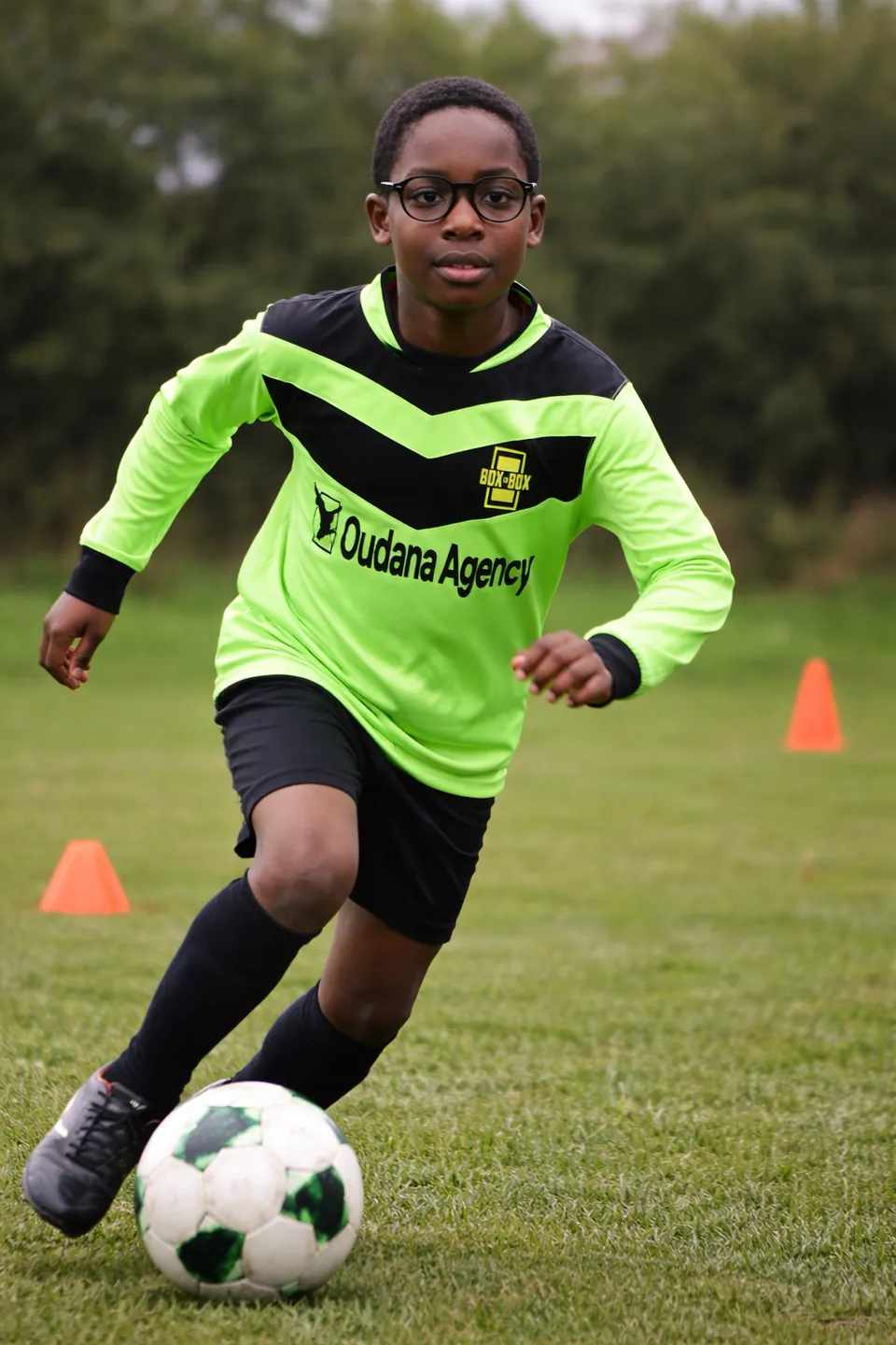 Young player training at Box to Box Academy during a youth football coaching session in Wolverhampton
